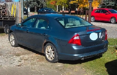 ford fusion and gmc 2500 truck Image# 1