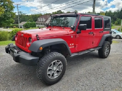 JEEP WRANGLER 4 PORTES DÉCAPOTABLE BAS KM 418-932-6595 Image# 1