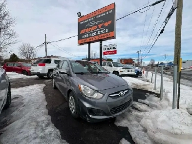 Hyundai Accent 2014 Man. 123 km A/C. $4495. Rusty 450-820-0550 Image# 1