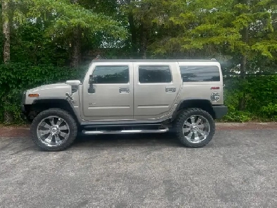 2005 Hummer H2. Champagne with black leather interior. Vortec V8