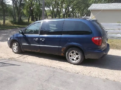 2001 Grand Caravan AWD 264K 3.6L Good driver,tires and glass.